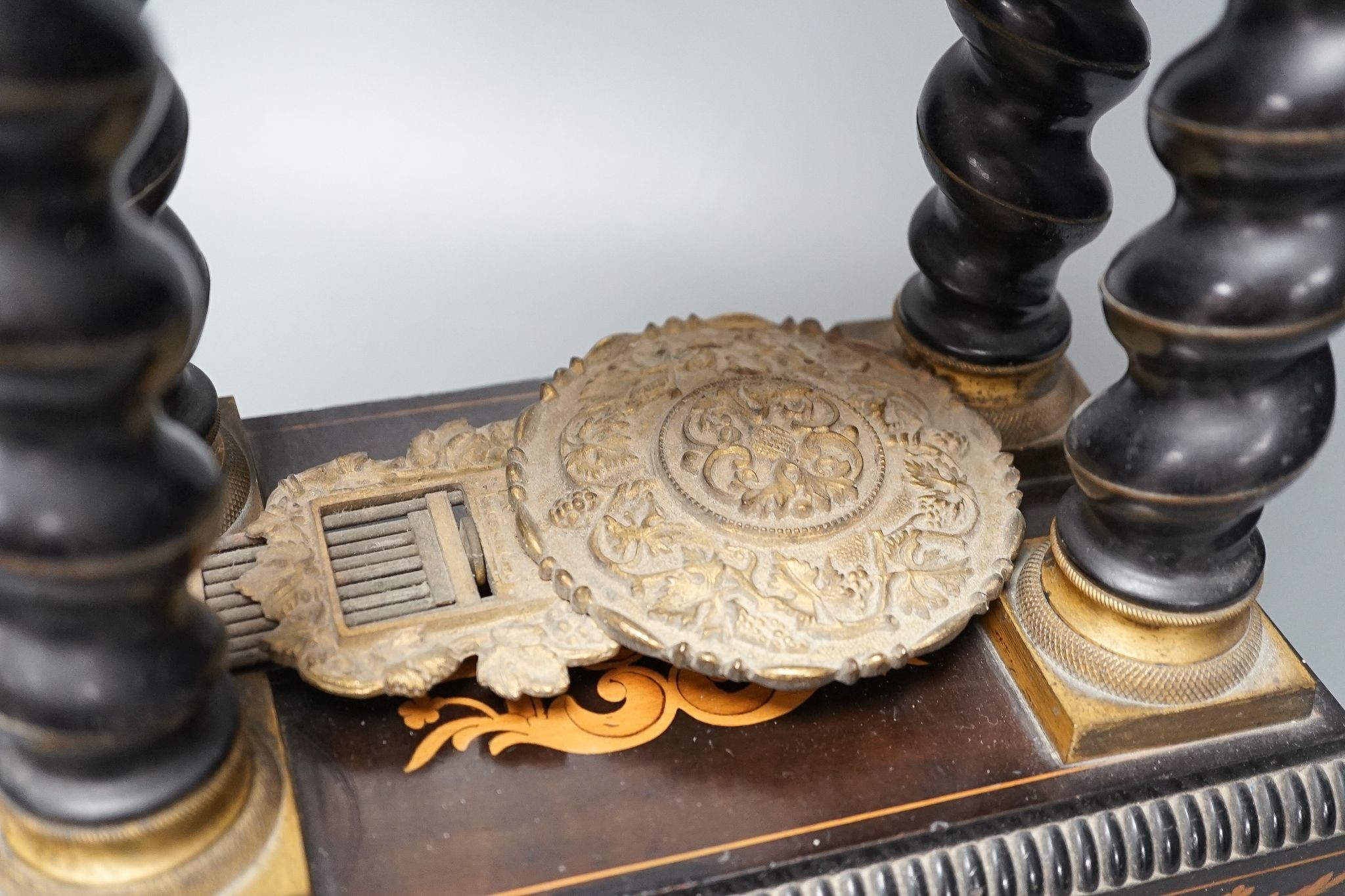 An ebonised and marquetry portico clock, dial signed Valogne, Paris, 56cm high